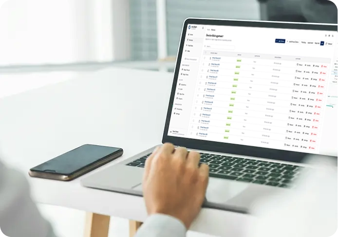 alt="Engineer reviewing system data on a laptop during deployment in a production environment"